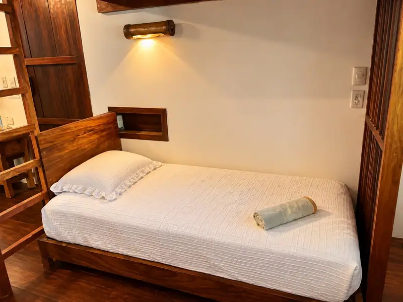 A single bed in the mezzanine room
